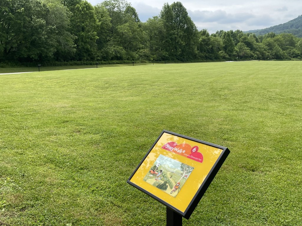  Image of a StoryWalk installation along a trail