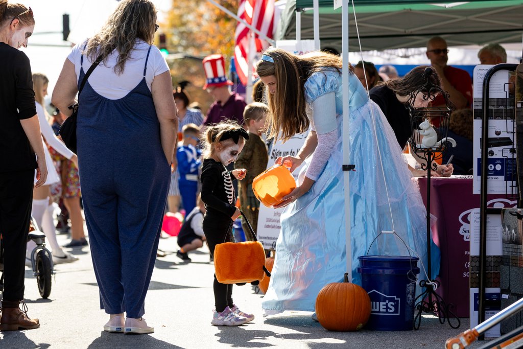 Kid trick-or-treating at Halloweenfest in Downtown Brevard to celebrate Halloween