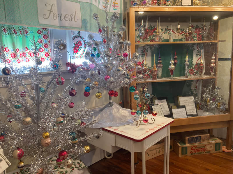 Vintage aluminum Christmas trees and ornaments at the ATOM exhibit at the Transylvania Heritage Museum