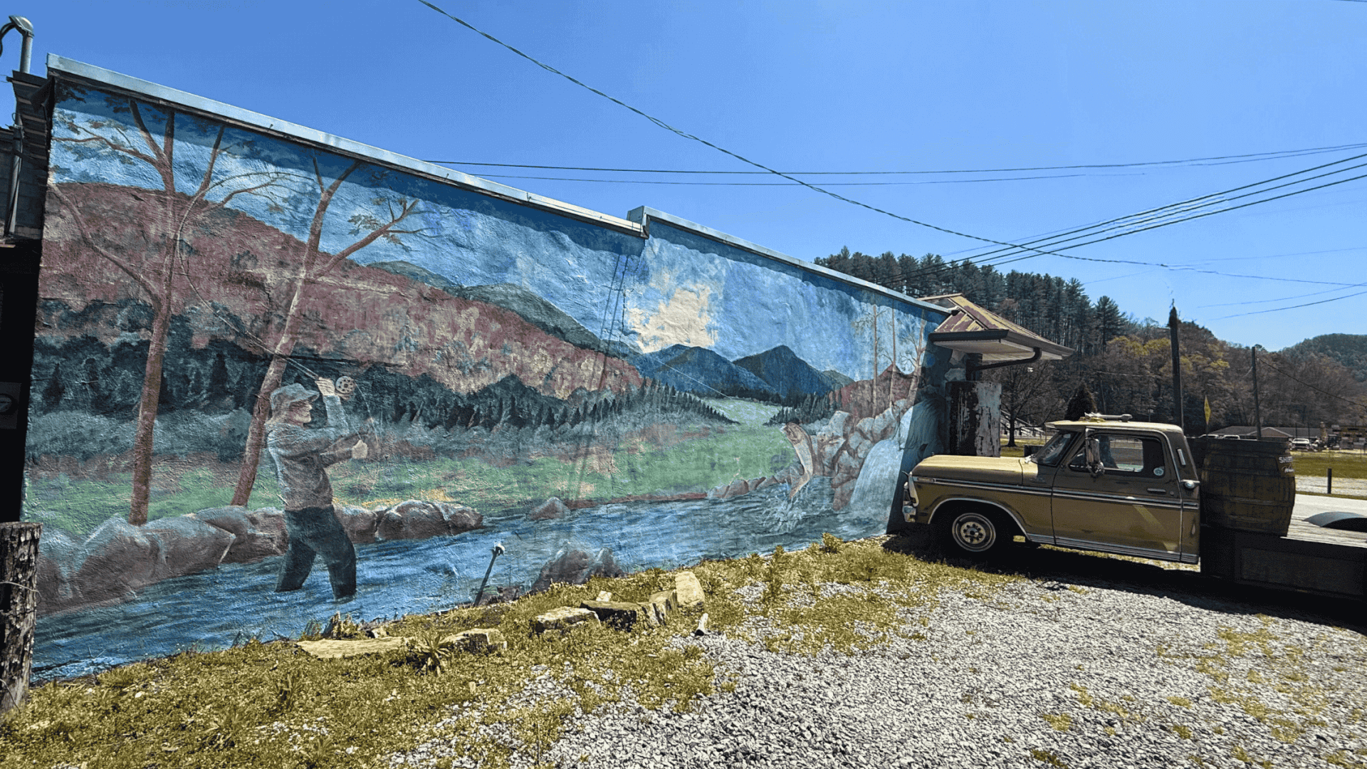 A mural in Downtown Rosman, featuring fly fishing on the French Broad River.